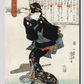 Ichi by Utagawa Kuniyoshi (1753-1806), a traditional Japanese ukiyo-e style illustration of a traditional Japanese woman standing and a book of moral education in the background