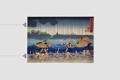 “People Walking Beneath Umbrellas Along the Seashore During a Rainstorm” by Utagawa Kuniyoshi (1798-1861), a woodcut illustrations of rural people traveling while raining.